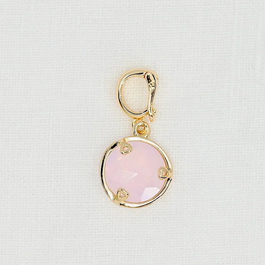 Gold pendant with a pink crystal