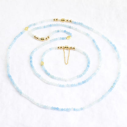 Set of beaded necklaces with gold accents on a white background