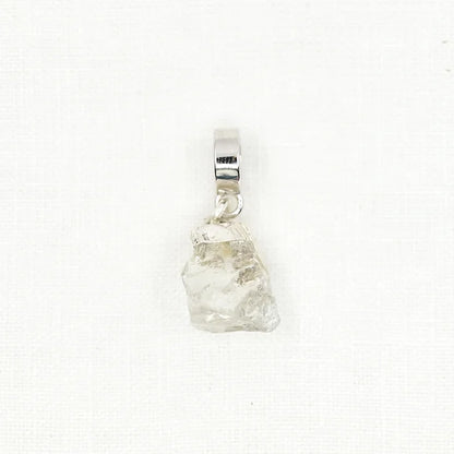 Clear crystal pendant on a white background