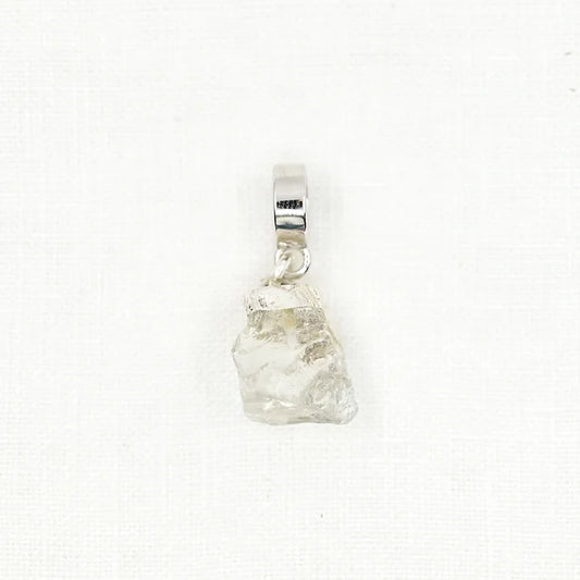 Clear crystal pendant on a white background