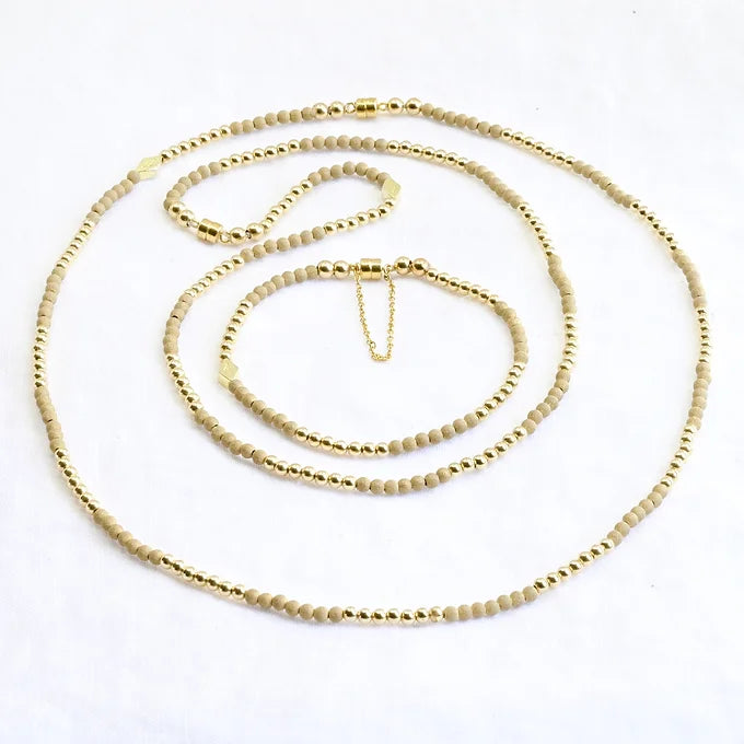 Gold chain necklace on a white background