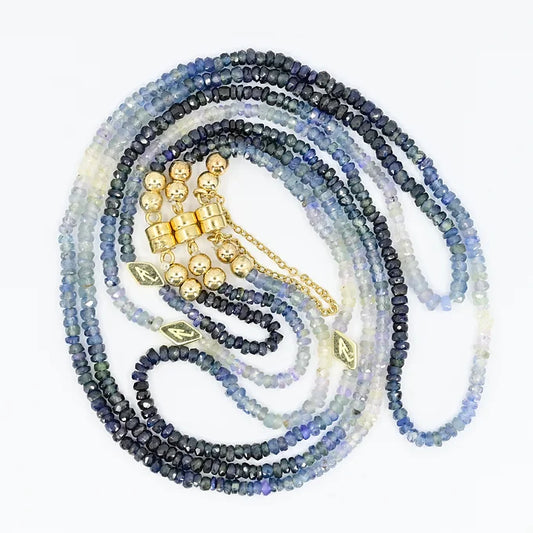 Beaded necklace with gold accents on a white background