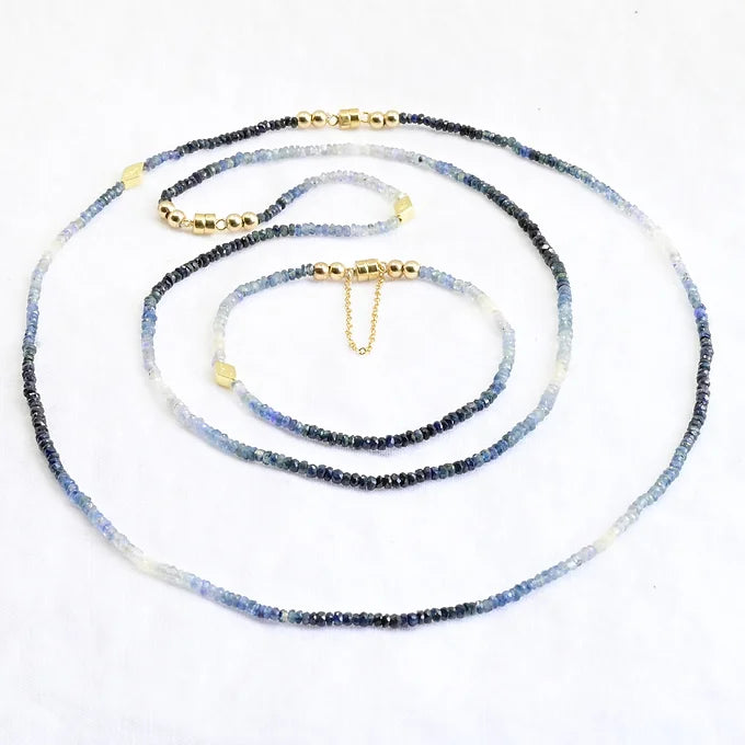 Necklace with blue and white beaded chain on a white background