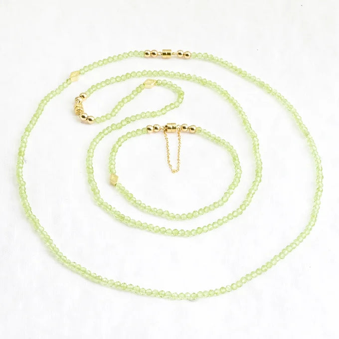 Necklace with green beads on a white background