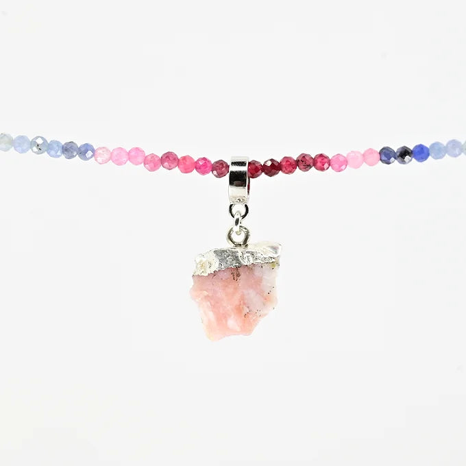 Necklace with pink stone pendant on a white background