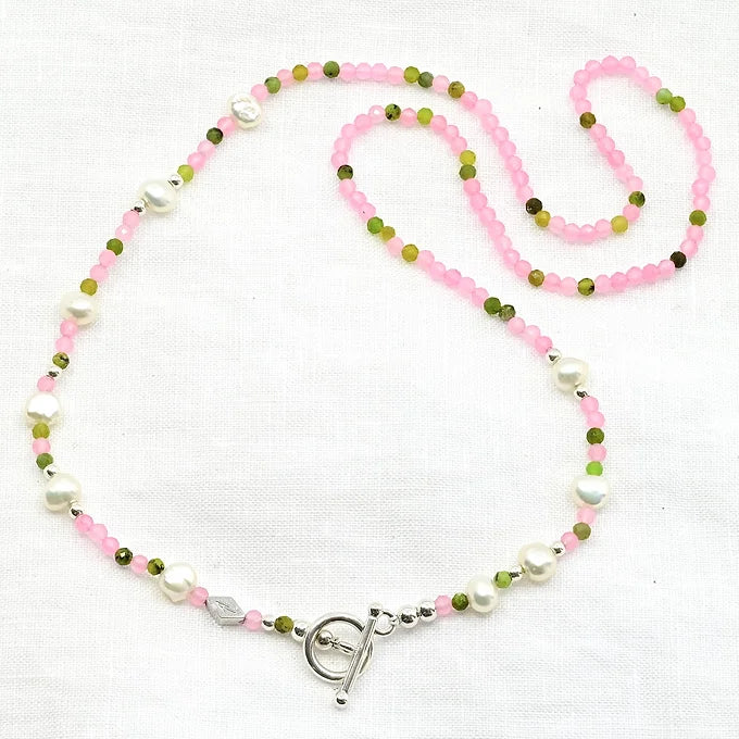 Necklace with pink, green, and white beads 