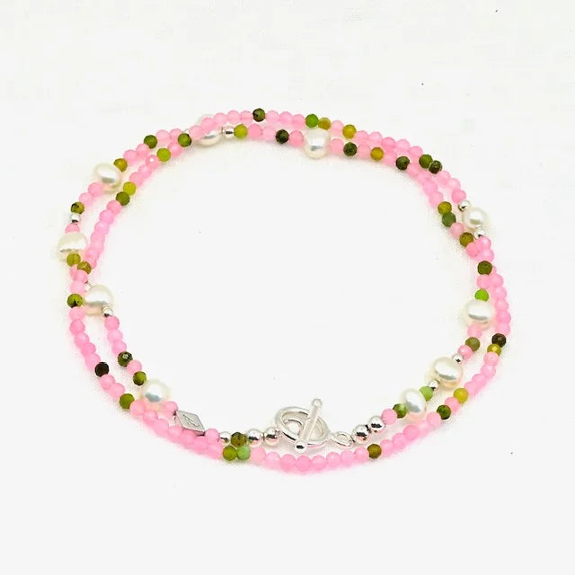 Beaded bracelet with pink, green, and silver beads