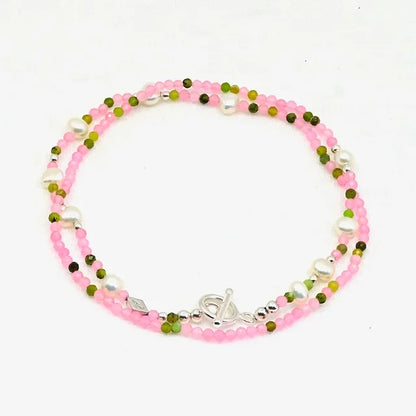 Beaded bracelet with pink, green, and silver beads