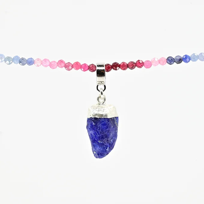 Necklace with multicolored beads and a blue pendant on a white background