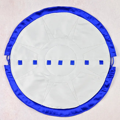 Round white mat with blue border and blue loops on a light grey background