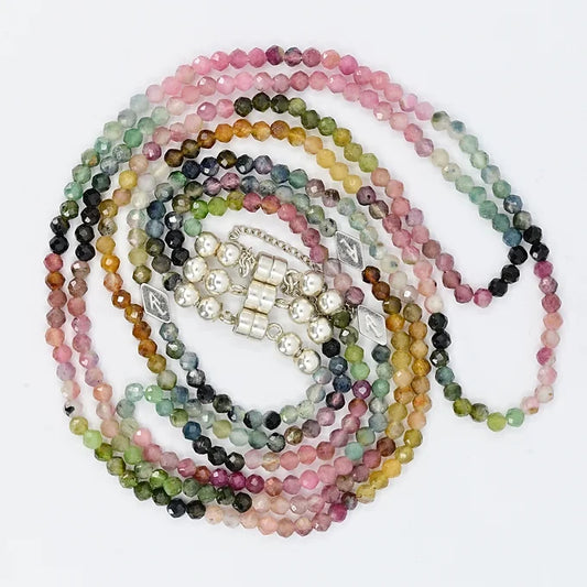 Multicolored beaded necklaces on a white background