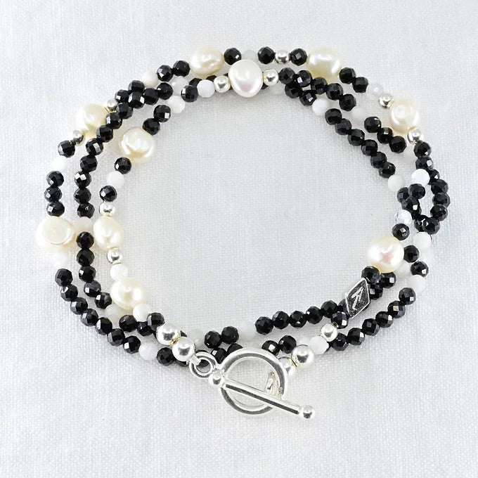 Beaded bracelet with black, white, and silver beads 