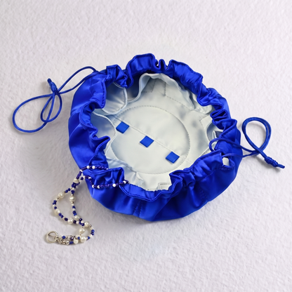 THE CYCLADES flat-lay silky jewellery travel pouch