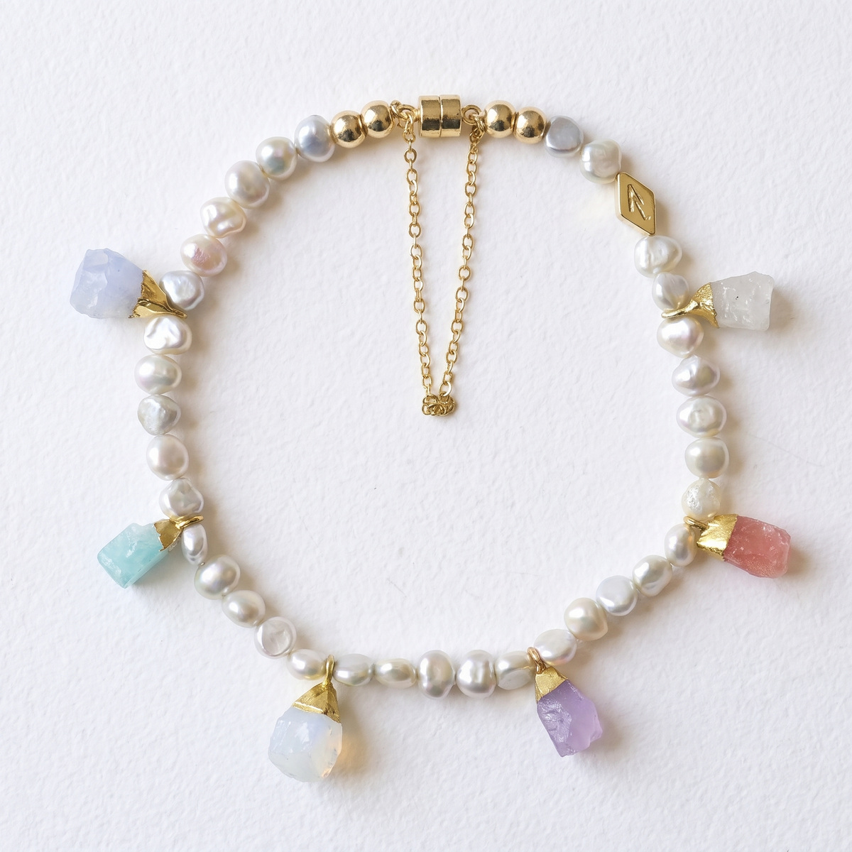 IVORY ROCK pearl and charm bracelet